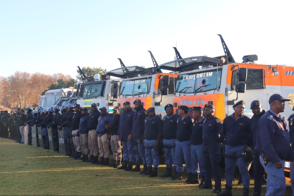 South African police officers patrol Johannesburg ahead of planned anti-migrant demonstrations.