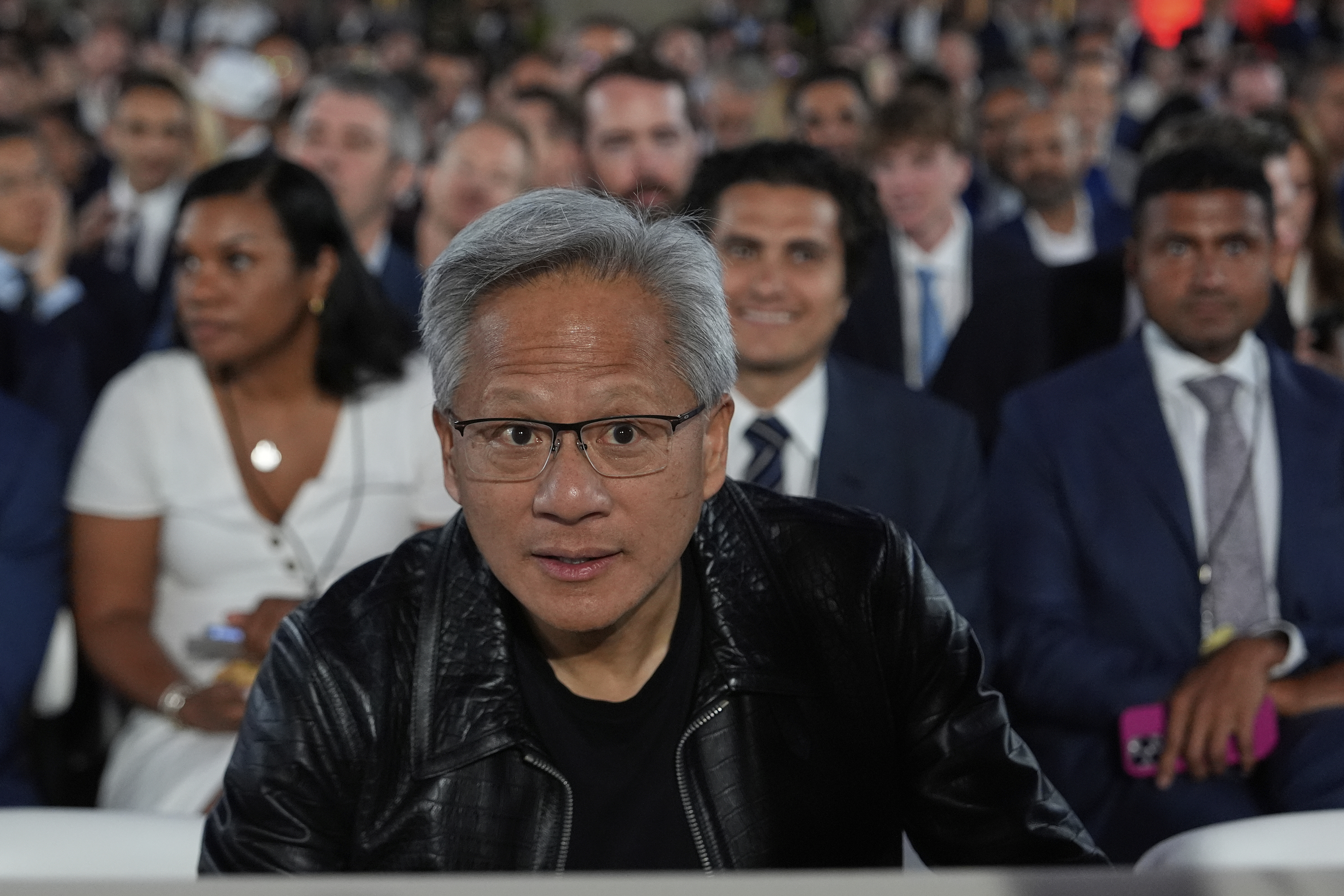 Nvidia CEO Jensen Huang arrives before President Donald Trump speaks during an AI summit July 23, 2025, in Washington.