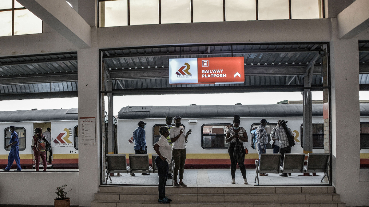 Passengers stand next to a train at the Kisumu railway station, on December 17, 2021. [Photo by Brian Ongoro/AFP]