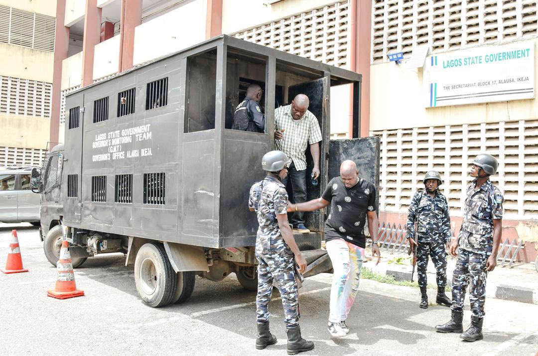 Lagos State Government officials during the arrest of fake enforcement officials in the Cele/Itire area of the state. [Twitter:@Mr_JAGs]