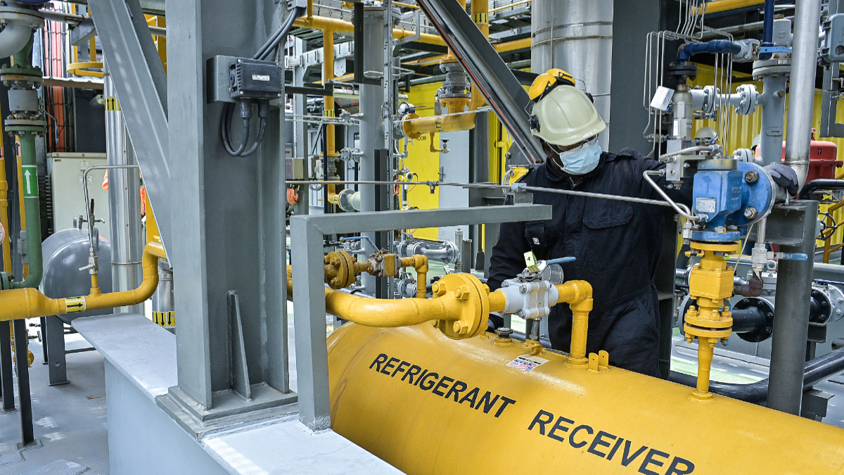 Cyprien Bigirimana, a maintainance technician seen inside the barge extracting methane gas on Lake Kivu, at the Kivuwatt power plant in Kibuye, Karongi District, in the Western Province of Rwanda, on November 1, 2021. [Photo by SIMON MAINA/AFP via Getty Images]