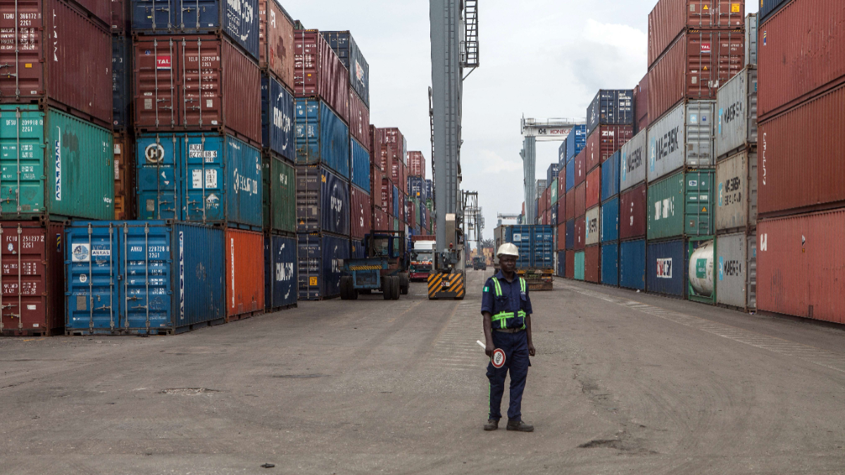 A member of the security stands among containers at the Lagos Tin-Can Island container terminal in Apapa, on October 7, 2015. Tin Can Island Port is Nigerias second largest seaport about seven kilometers due west of the city centre of Lagos across Lagos harbor. [Photo by FLORIAN PLAUCHEUR/AFP via Getty Images]