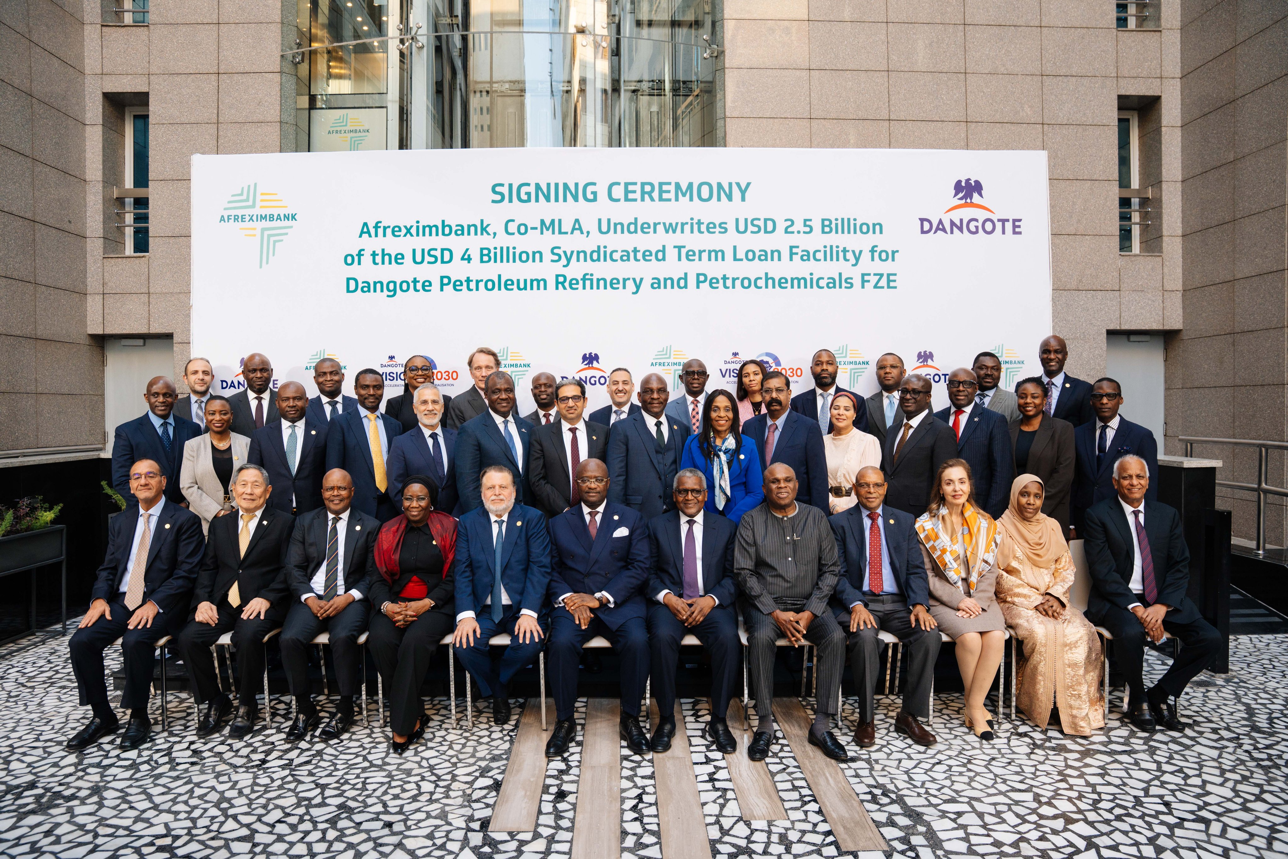 Dr. George Elombi, President and Chairman of the Board of Directors, Afreximbank, and Mr. Aliko Dangote, President/Chief Executive, Dangote Industries Limited, joined by Afreximbank Board members and the Bank’s executive leadership during the signing ceremony in Cairo, Egypt. [Afrexim bank]