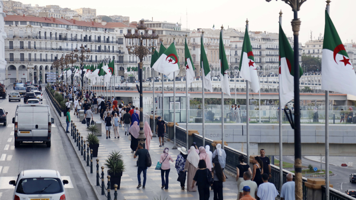 People walk on a street in Algiers, Algeria, on July 21, 2025. [Photo by Billel Bensalem / APP/NurPhoto via Getty Images]