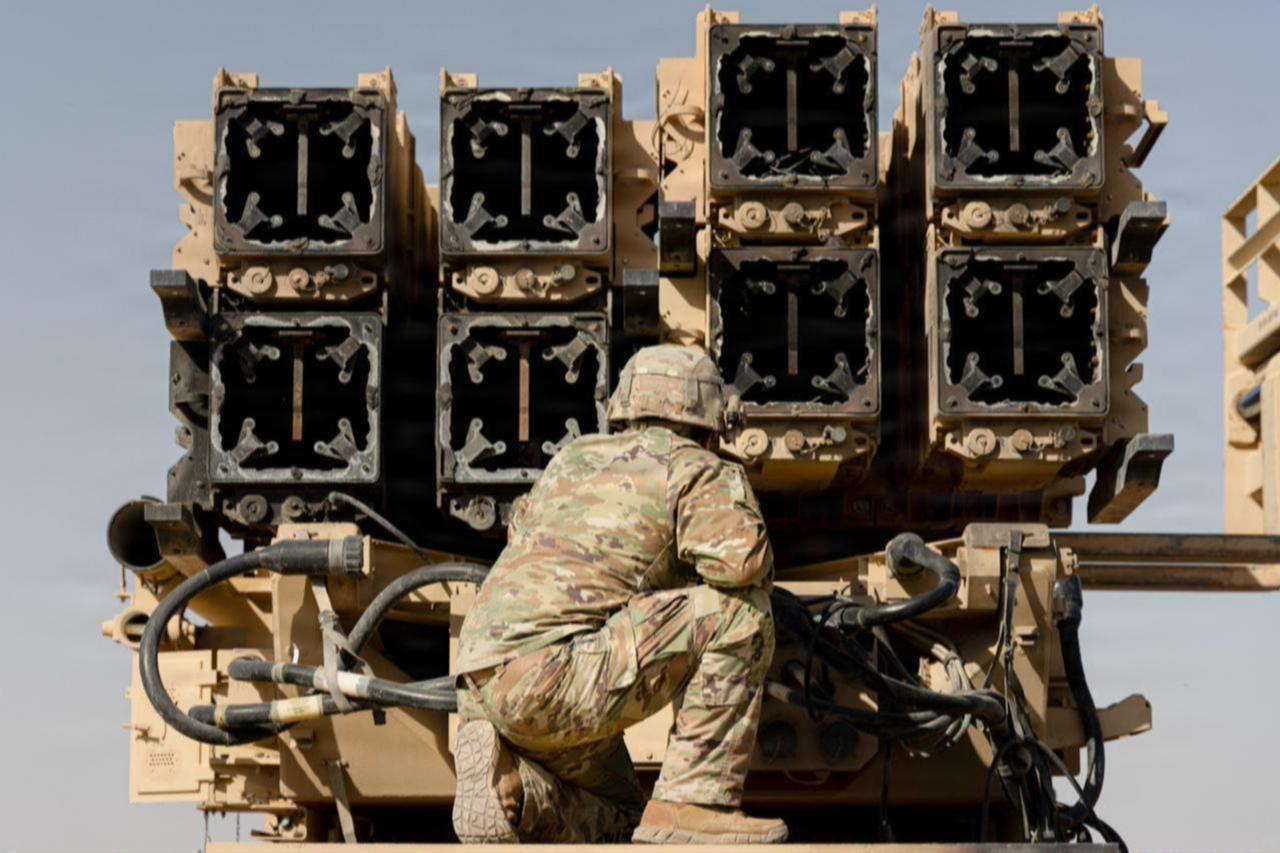 A US Army air defense artilleryman watches as spent Patriot interceptors are cross-loaded for transport in the Middle East, date and time undisclosed (Photo via US Army)