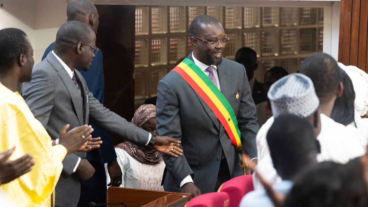 Former Senegal Prime Minister Ousmane Sonko (C) wears his parliamentary sash on May 26, 2026, at the National Assembly in Dakar. [Photo by SEYLLOU / AFP via Getty Images]