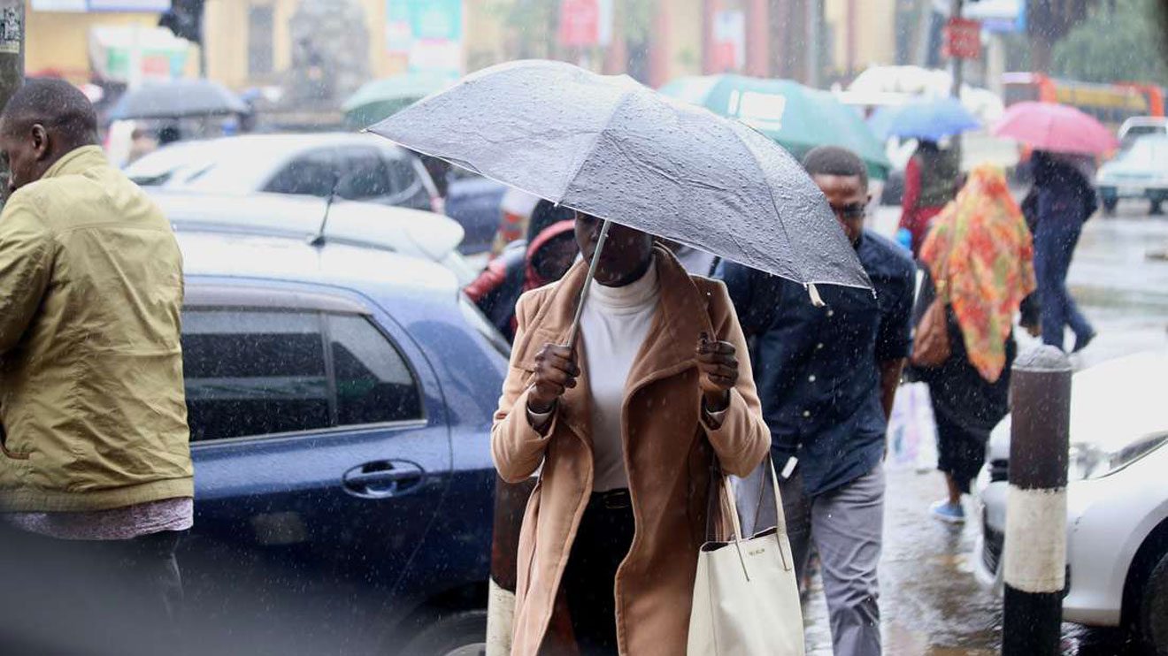 Kenyans experiencing rainfall in Nairobi