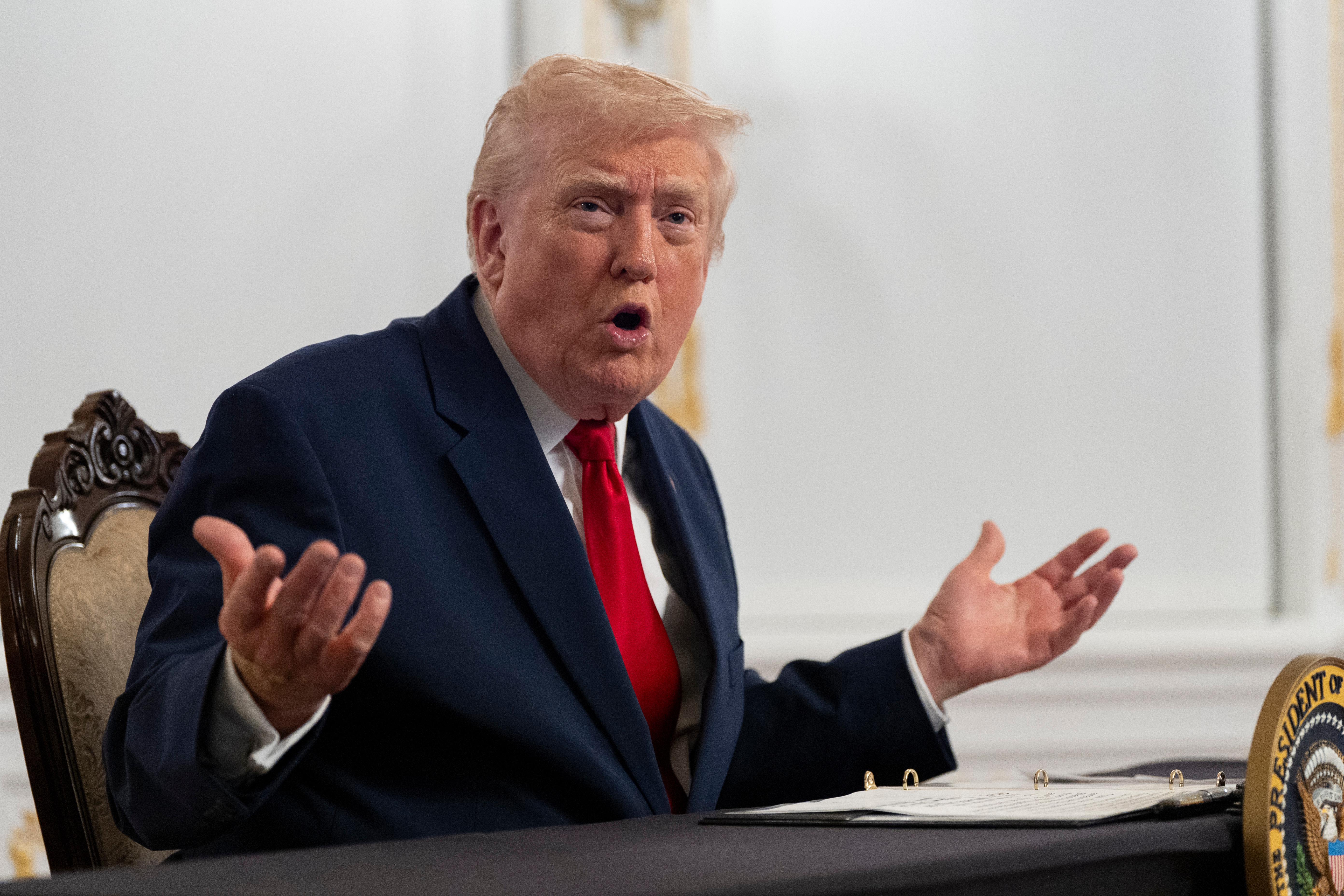 President Donald Trump speaks to reporters after speaking to troops via video from his Mar-a-Lago estate on Thanksgiving, Nov. 27, 2025, in Palm Beach, Florida.
