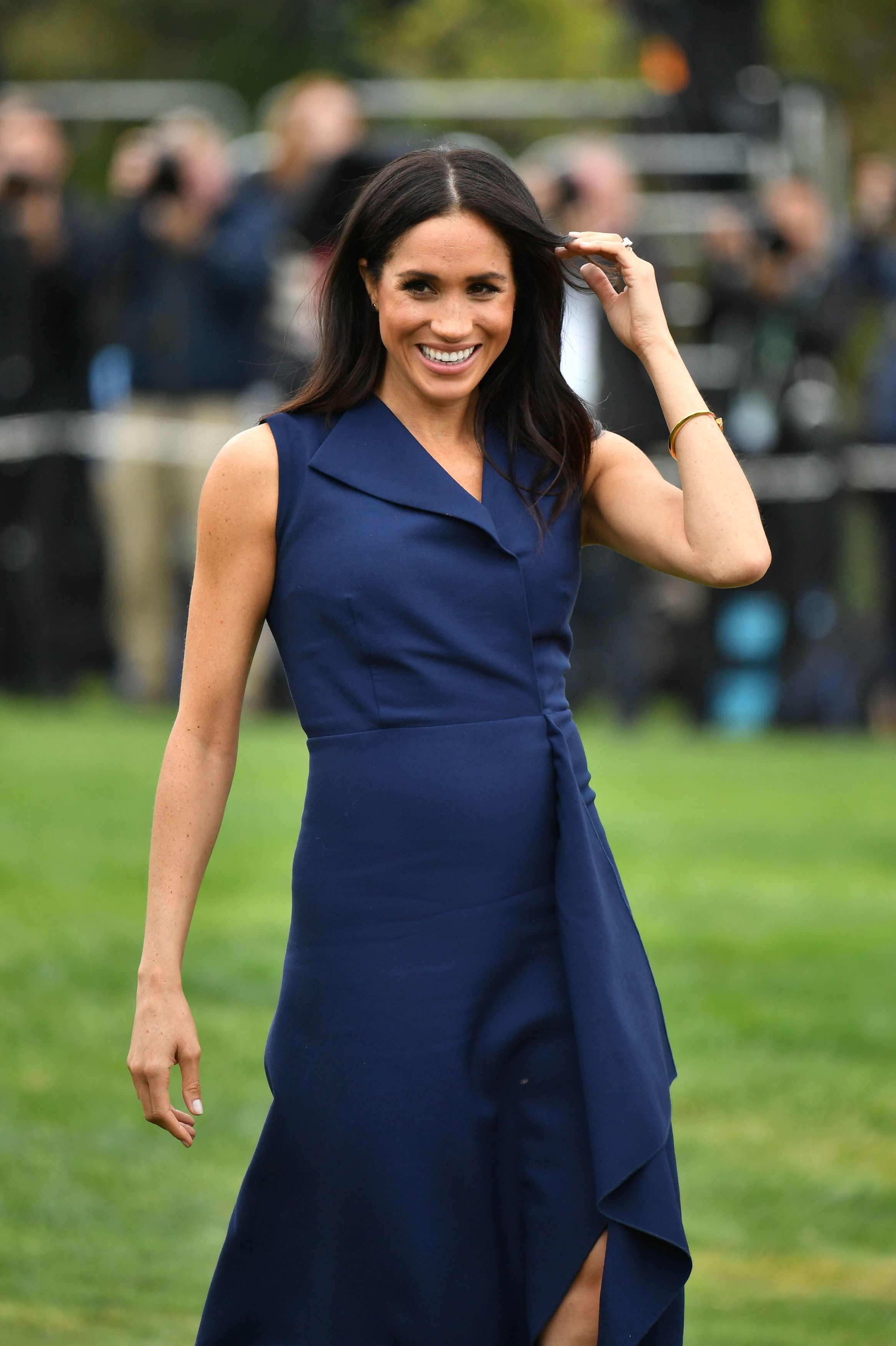 Ținuta care i-a scos în evidență burtica de gravidă lui Meghan Markle | FOTO