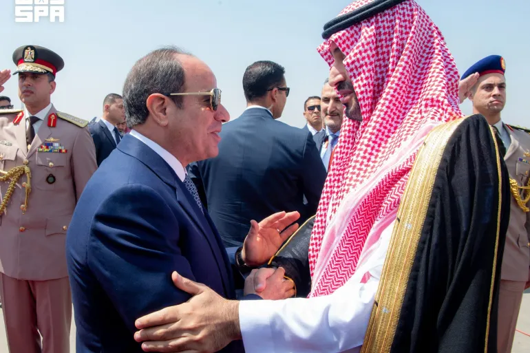 Egyptian President Abdel Fattah el-Sisi shakes hands with Saudi Crown Prince Mohammed bin Salman during an event in Egypt [Image Credit: Ahmed Nureldine/AFP]