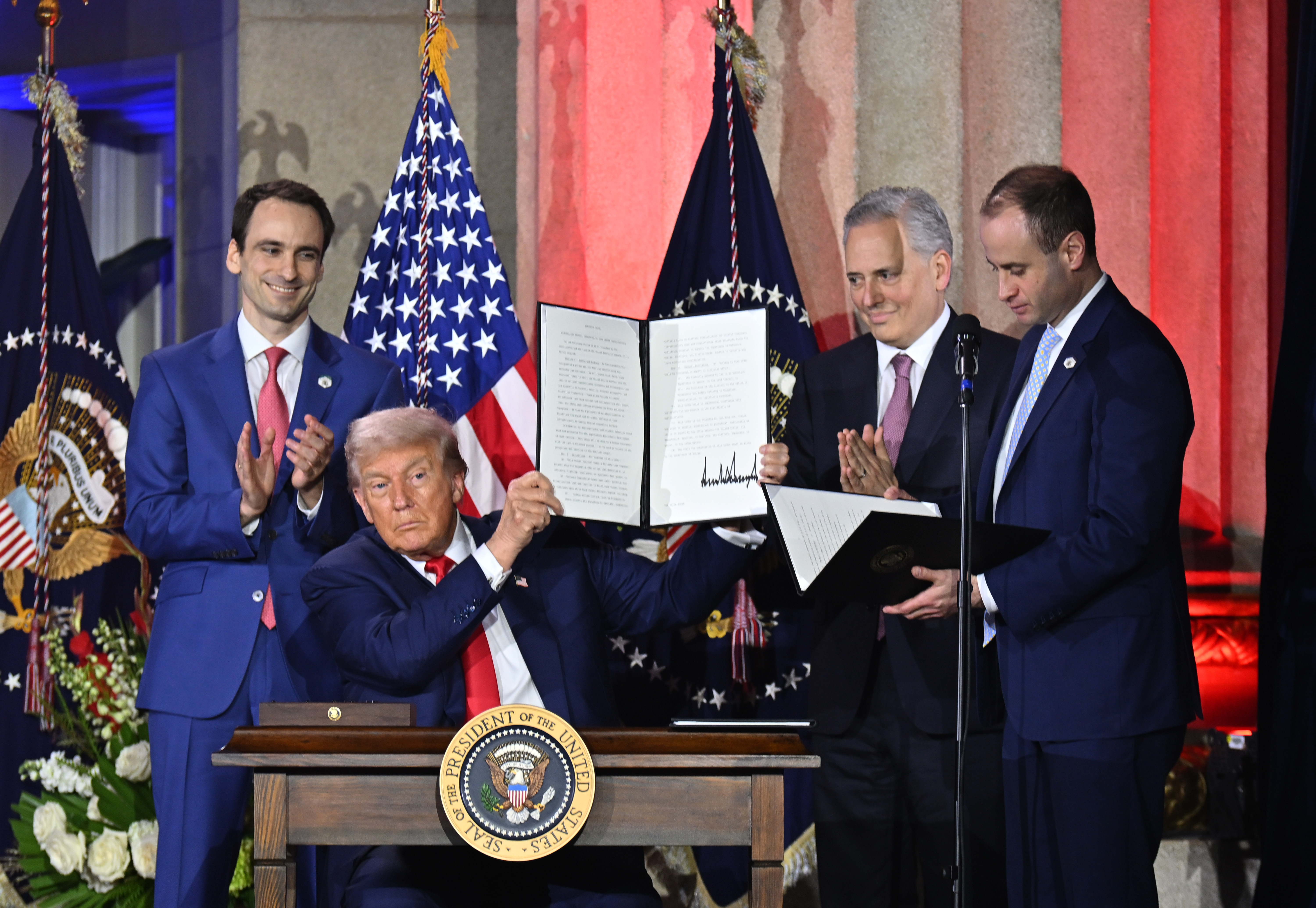 Michael Kratsios, U.S. President Donald Trump and David Sacks speak onstage at the All-In and Hill &amp; Valley Forum on July 23, 2025 in Washington, DC. (Photo by Roy Rochlin)