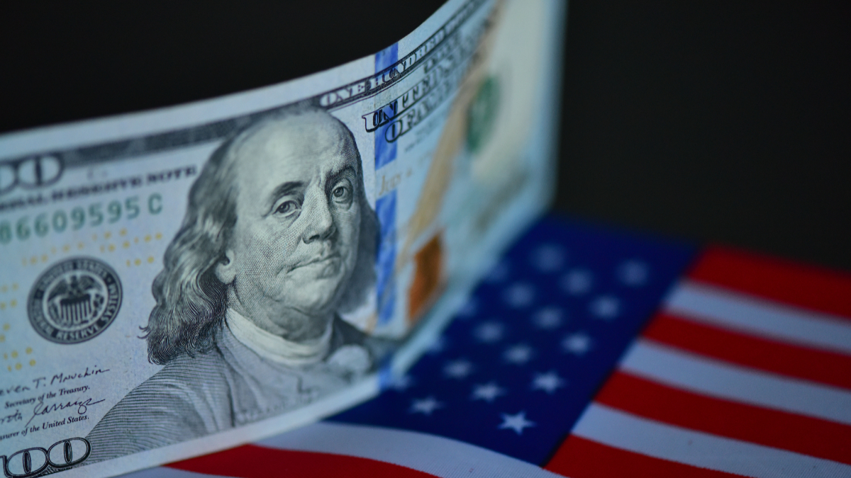 US dollar banknotes are captured in Fuyang City, Anhui Province, China, on December 11, 2025. [Photo by Costfoto/NurPhoto via Getty Images]