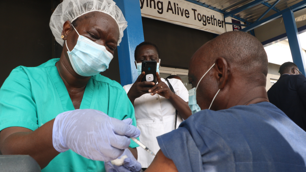 A person receives a dose of the Oxford/AstraZeneca coronavirus disease (COVID-19) vaccine at the Cacovid isolation centre, Mainland Infectious Disease Hospital, Yaba, in Lagos, Nigeria. [Photo by: Emmanuel Osodi/Majority World/Universal Images Group via Getty Images]