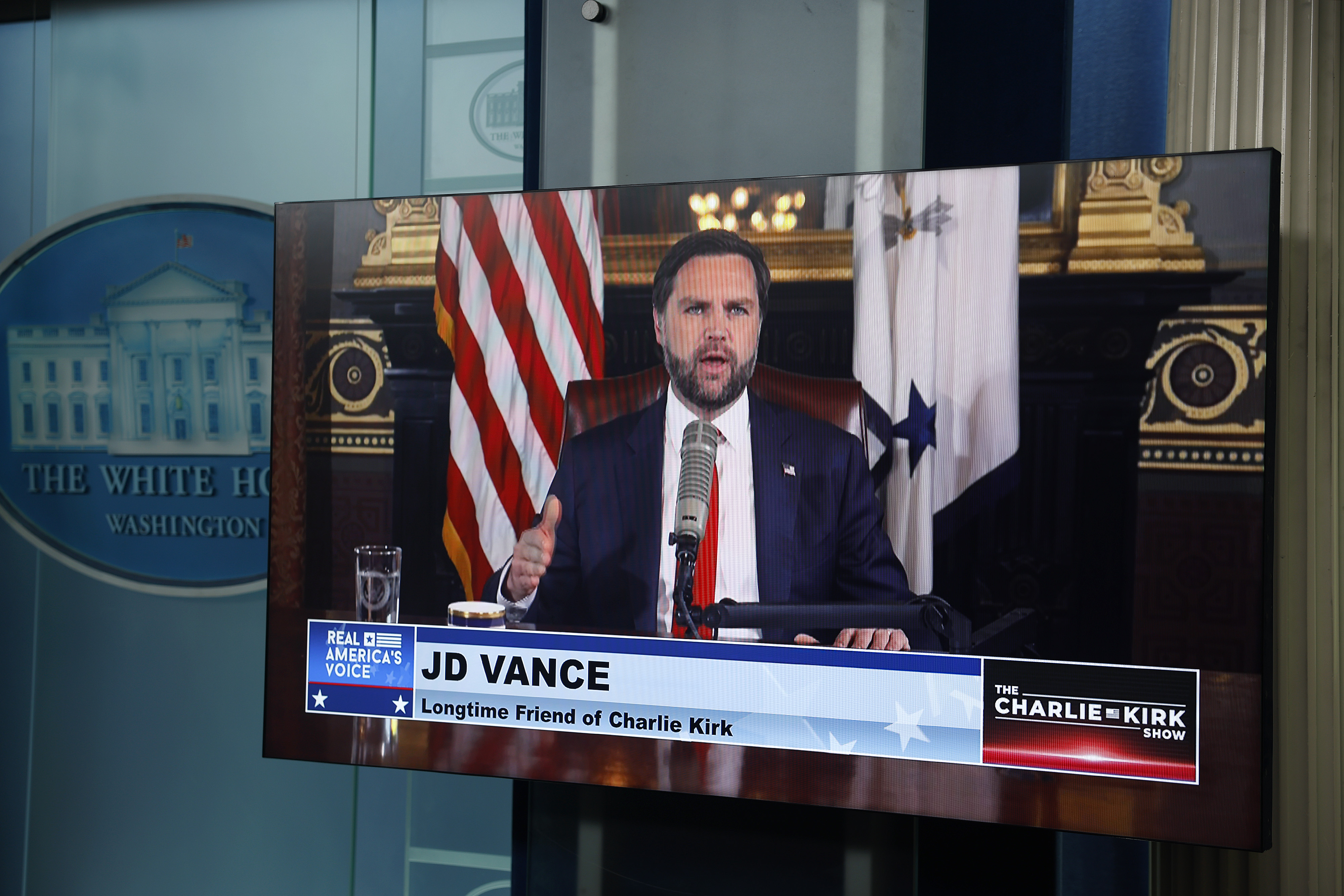 WASHINGTON, DC - SEPTEMBER 15: A video feed is displayed in the White House Briefing Room as U.S. Vice President JD Vance hosts a podcast episode of 'The Charlie Kirk Show' following the assassination of the show's namesake, at the White House on September 15, 2025 in Washington, DC. Tyler Robinson is accused of fatally shooting Charlie Kirk, CEO and co-founder of Turning Point USA, while he was speaking at an event for his 