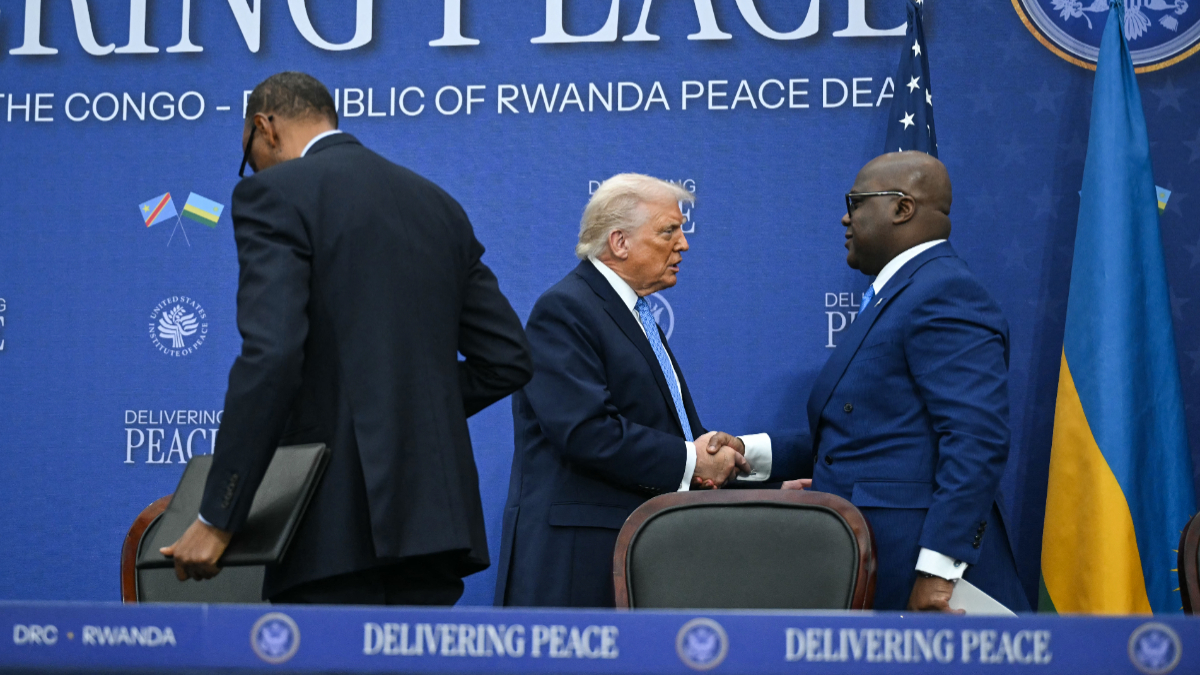 US President Donald Trump shakes hands with the President of the Democratic Republic of the Congo Felix Tshisekedi (L) during signing ceremony of a peace deal between Rwanda and the Democratic Republic of the Congo at the United States Institute of Peace in Washington, DC, on December 4, 2025. [Photo by ANDREW CABALLERO-REYNOLDS / AFP via Getty Images]