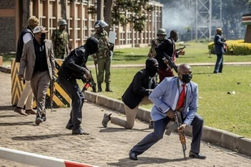 Police officers and security personnel take position to protect Parliament during Finance Bill 2024 protests in Nairobi, on June 25, 2024.