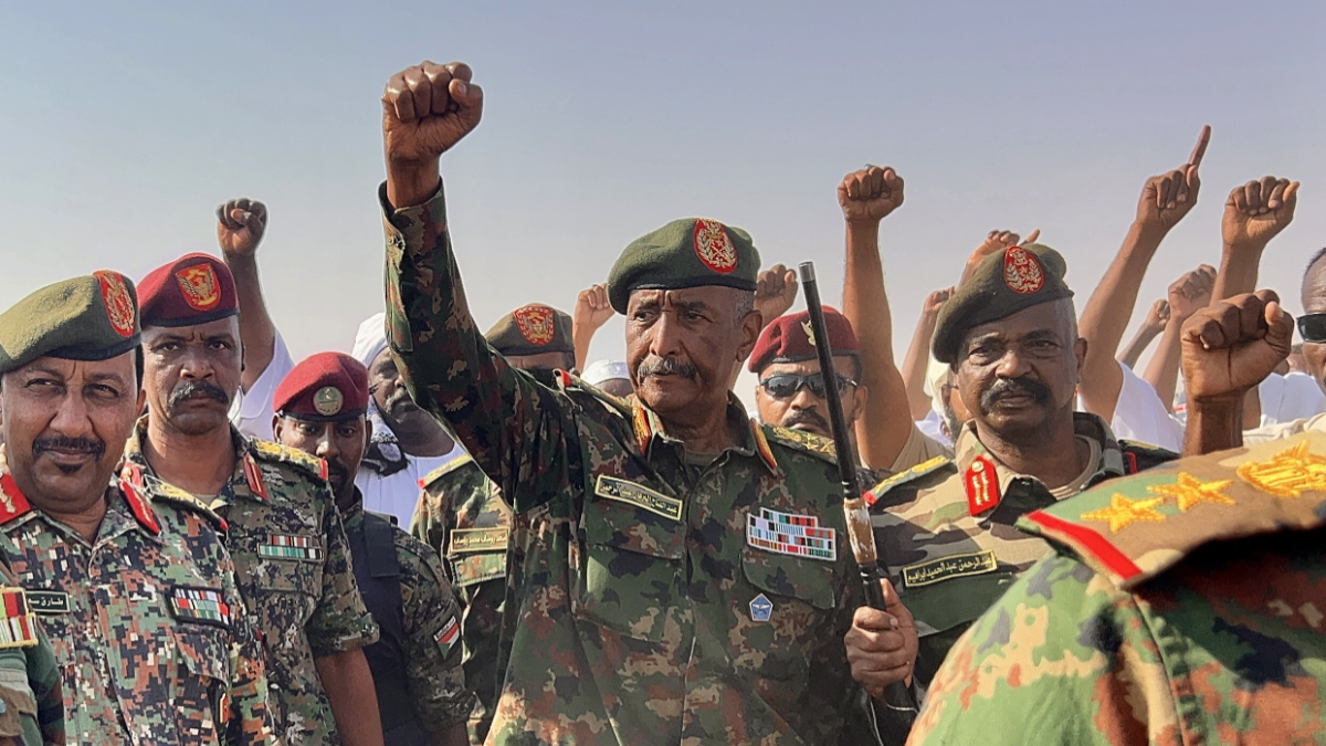 Sudan's Sovereignty Council Chairman and Army Commander Gen. Abdel Fattah al-Burhan visits the newly established Al-Afadh camp in Al Dabbah, Northern State, where tens of thousands of Sudanese have taken refuge after being displaced by clashes following the Rapid Support Forces' takeover of El Fasher, the capital of North Darfur, on October 26, in Al Dabbah, Sudan, on November 8, 2025. [Photo by Stringer/Anadolu via Getty Images]