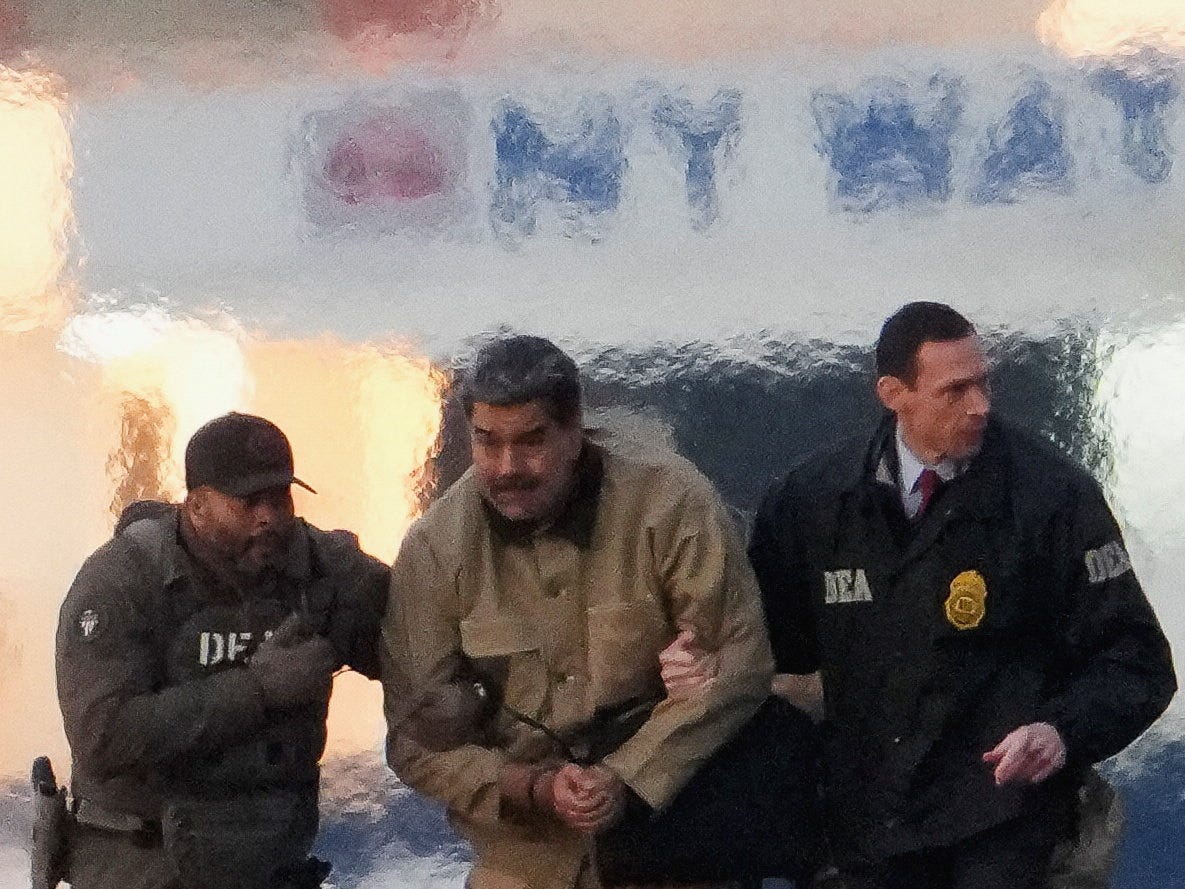 Law enforcement officials move captured Venezuelan President Nicols Maduro at Downtown Manhattan Heliport.Adam Gray/REUTERS