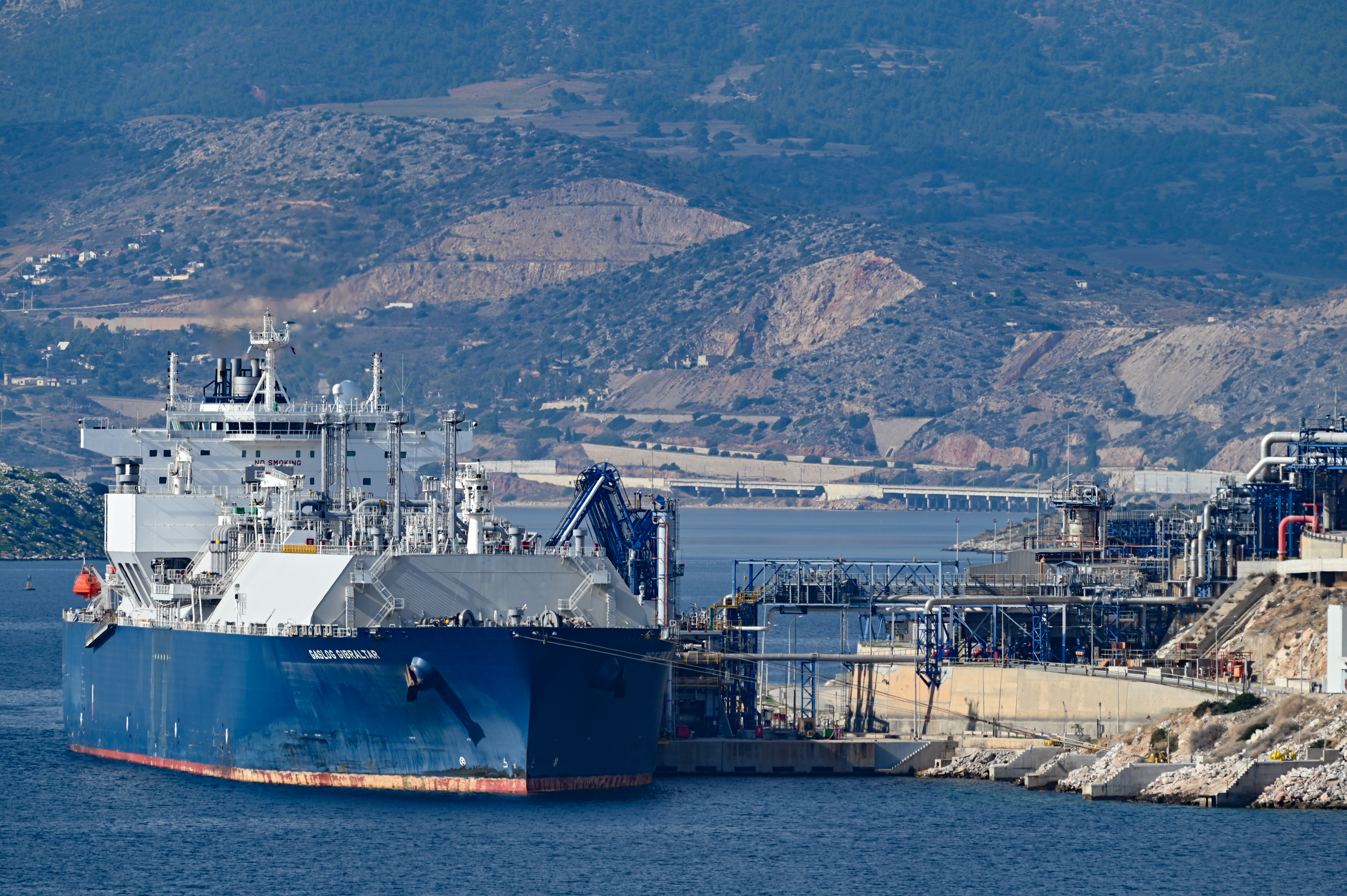 The LNG tanker GASLOG GIBRALTAR, which departs under a deal with Shell from the Idku terminal in Egypt, unloads Egyptian liquefied natural gas at the Revithoussa terminal near Athens, in Megara, Greece, on November 17, 2025. Egypt exports LNG in an effort to consolidate its position as a regional energy trading hub. [Photo by Nicolas Koutsokostas/NurPhoto via Getty Images]
