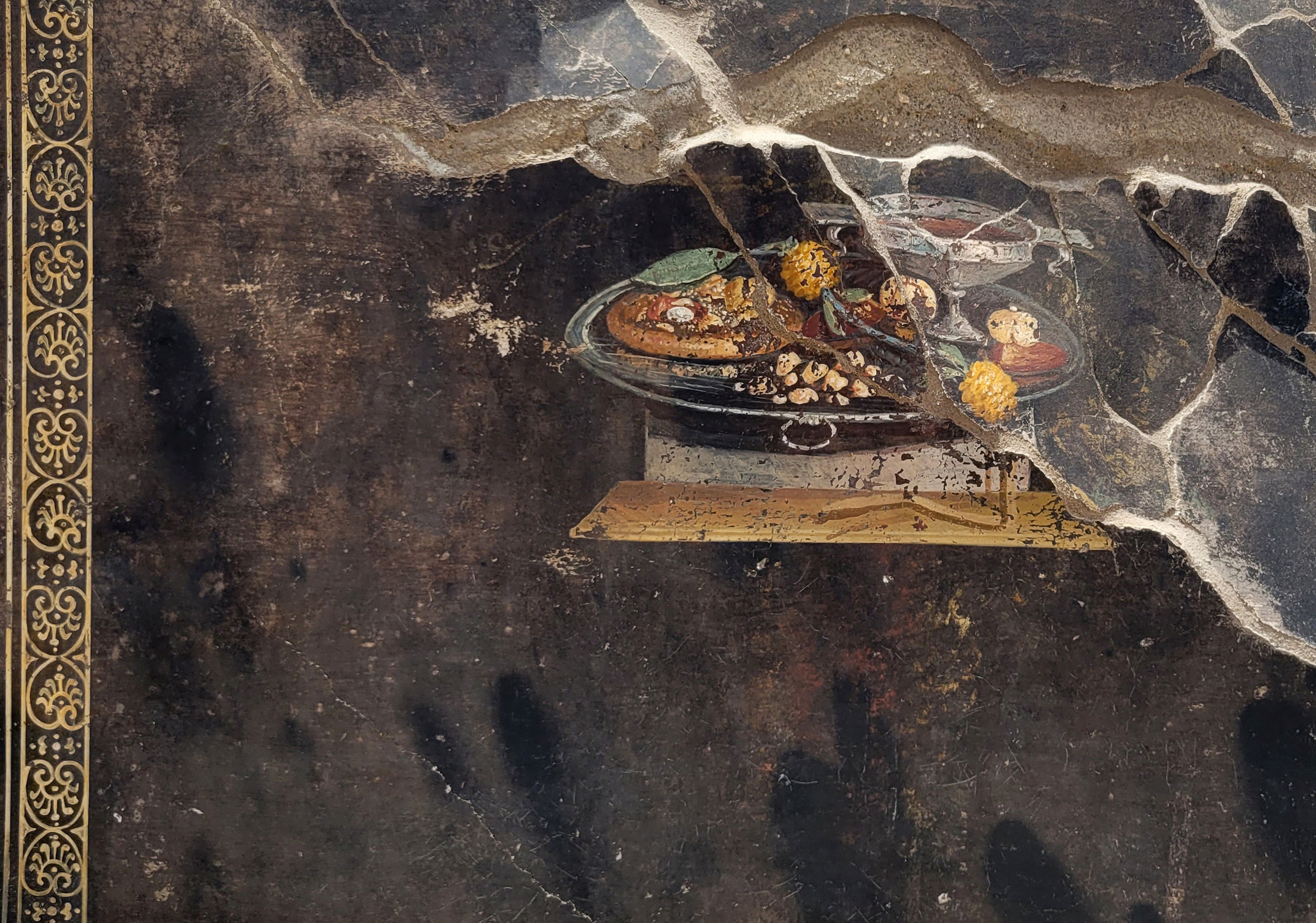 O frescă veche de 2.000 de ani, descoperită în orașul Pompei, pare să ilustreze o pizza antică
