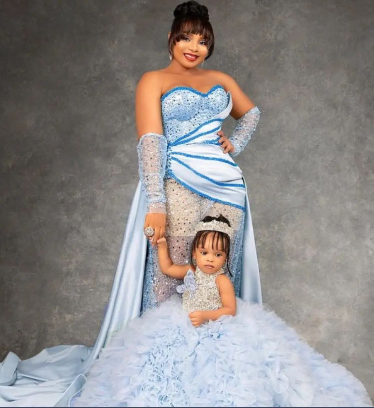 Queen Mercy Atang and Princess Kielah in their blue gowns [Instagram/Queen Mercy Atang]