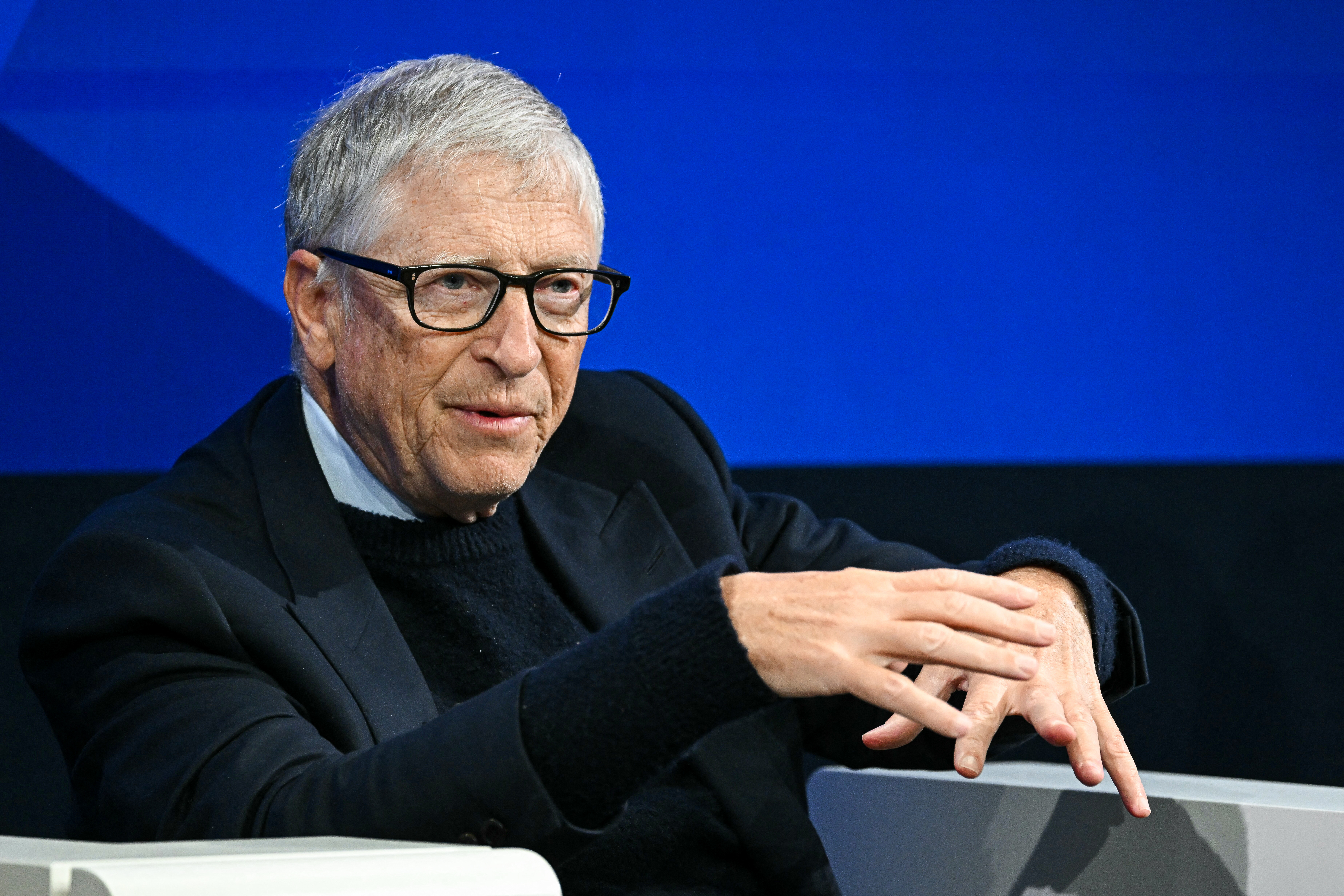 Microsoft co-founder and US philanthropist Bill Gates gestures as he speaks during the World Economic Forum (WEF) annual meeting in Davos on January 21, 2026. [Photo by Fabrice COFFRINI / AFP via Getty Images]
