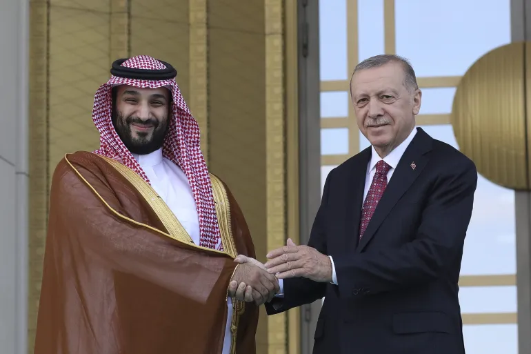 Türkiye President Recep Tayyip Erdogan and Saudi Crown Prince Mohammed bin Salman shake hands [Image Credit: Burhan Ozbilici/AP Photo]