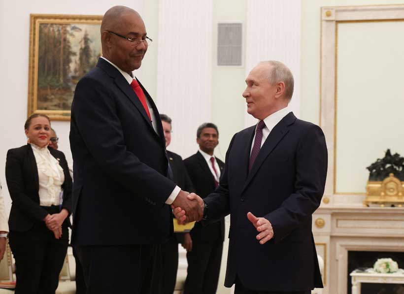 Russian President Vladimir Putin shakes hands with Seychelles President Patrick Herminie during a meeting in Moscow, Russia, April 22, 2026. Maxim Shipenkov/Pool via REUTERS