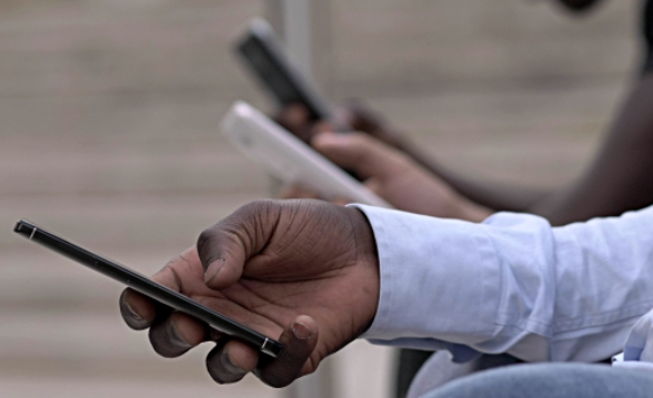 Kenyan on a mobile phone 