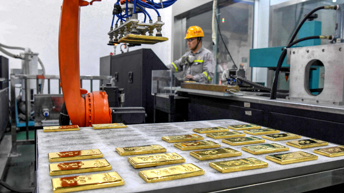 A worker produces gold ingots at a non-ferrous metal company on January 23, 2025 in Tongling, Anhui Province of China. [Guo Shining/VCG via Getty Images]