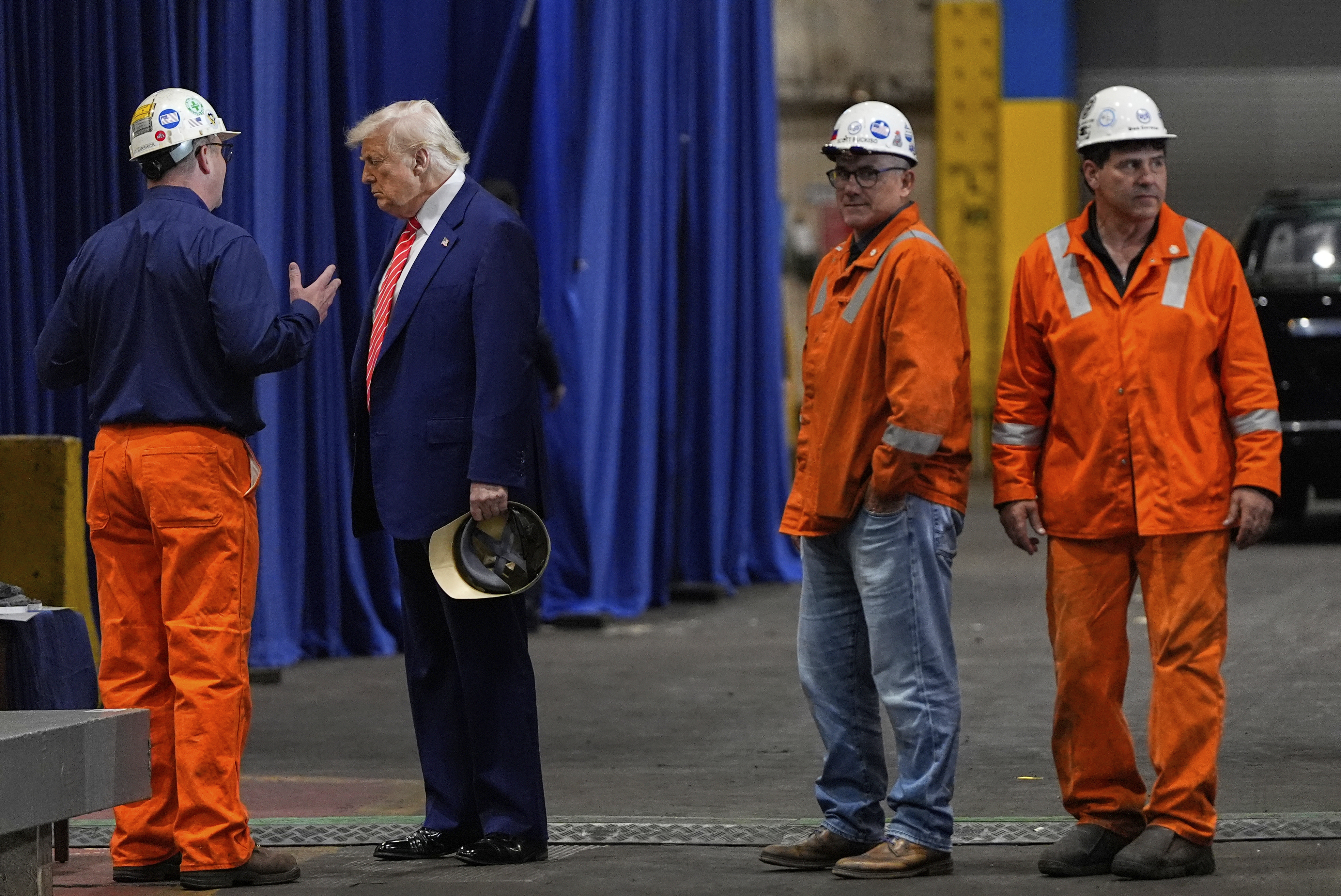 President Donald Trump talks to workers as he tours U.S. Steel Corporation's Mon Valley Works-Irvin plant May 30, 2025, in West Mifflin, Pennsylvania.