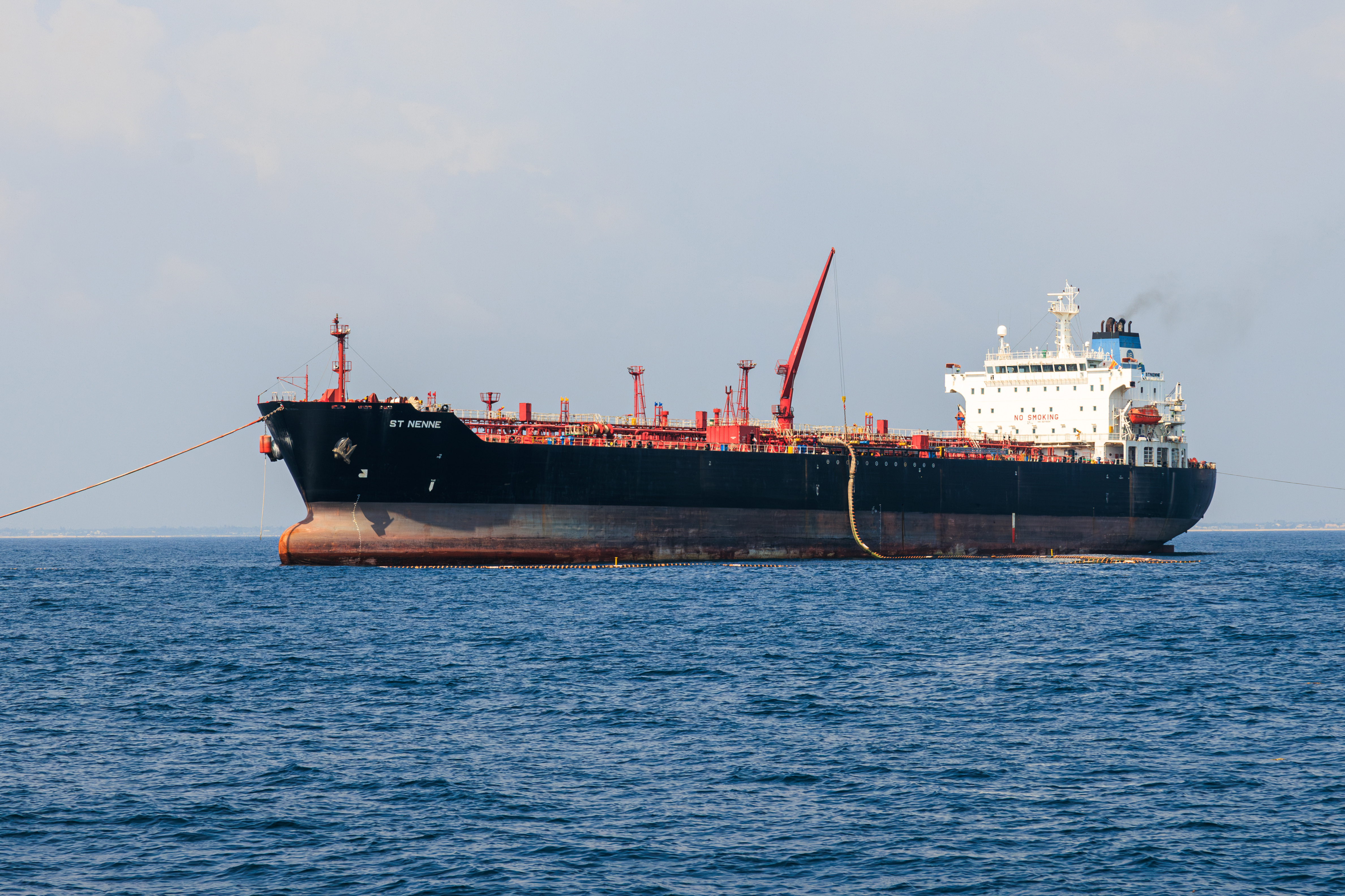 A tanker discharges crude oil via single-point mooring (SPM) during a ceremony to mark the first delivery of crude oil to the Dangote Industries Ltd. refinery in the Ibeju Lekki district of Lagos, Nigeria, on Saturday, Dec. 9, 2023. [Photo: Benson Ibeabuchi/Bloomberg via Getty Images]
