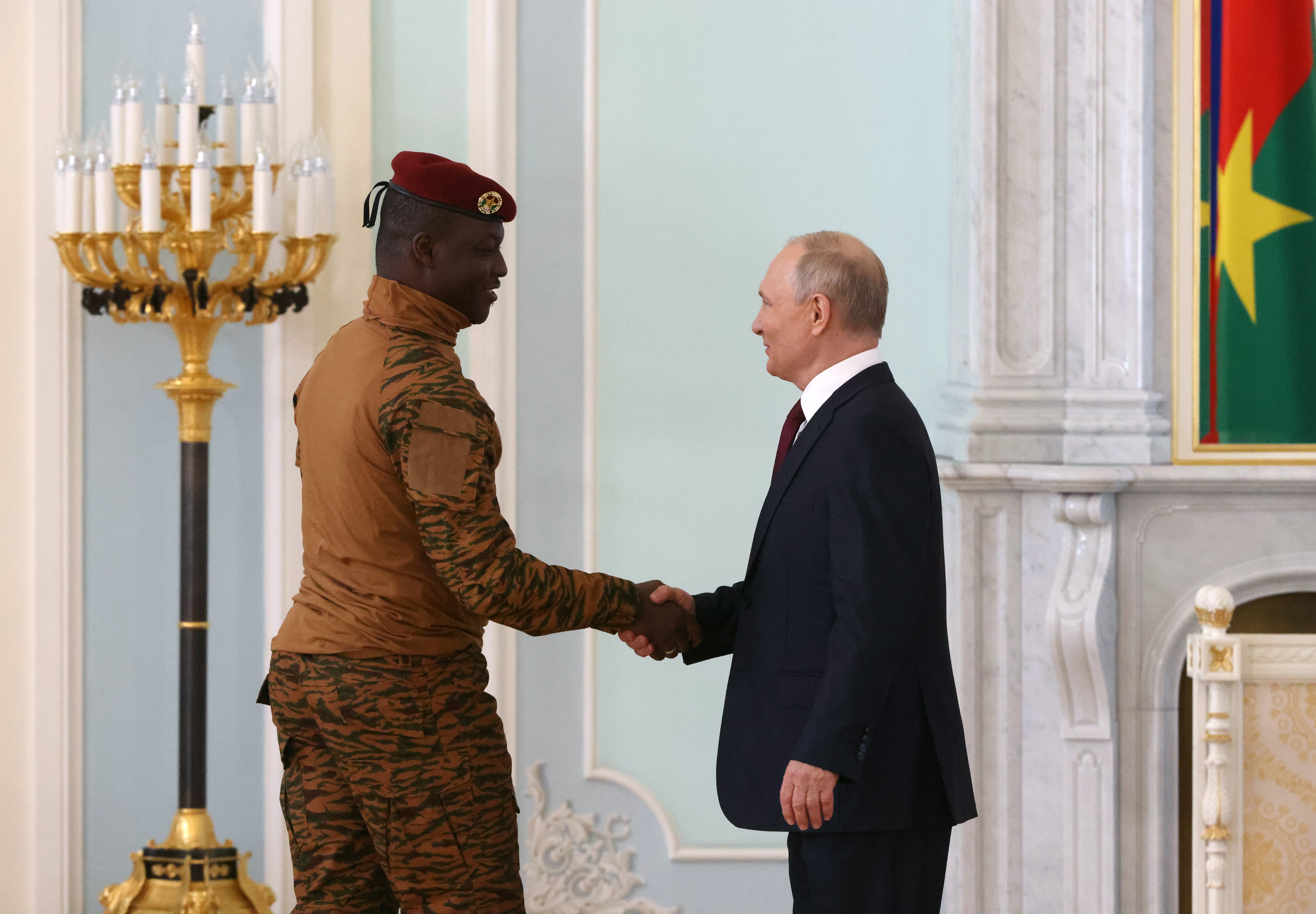Russian President Vladimir Putin (R) greets Burkina Faso's President Ibrahim Traore (L) during their bilateral meeting on July 29, 2023 in Saint Petersburg, Russia. [Photo by Contributor/Getty Images]