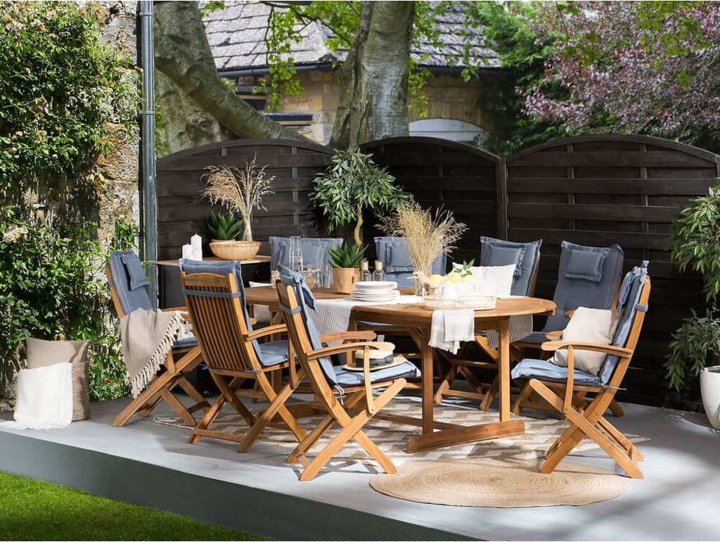 Beliani Zestaw ogrodowy stół i 8 krzeseł z niebieskimi poduszkami MAUI