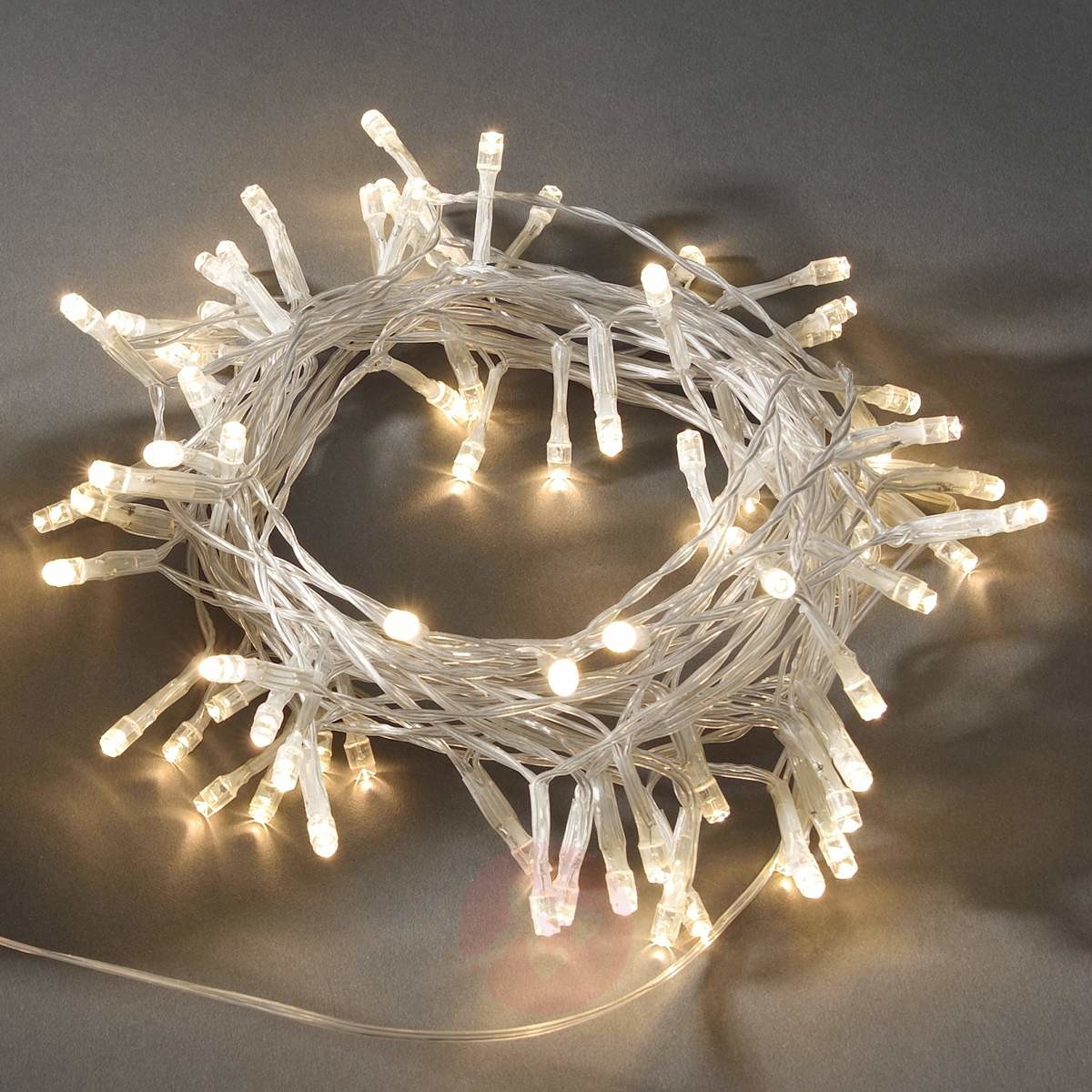 Konstsmide 3728 103 LED łańcuch świetlny/na zewnątrz (IP44)/zasilana na baterie: 2 X D 1.5 V (brak w wyposażeniu)/O czujnik światła, 6h i 9H Timer/80 ciepło białych diod/przezroczysty (3728-103)
