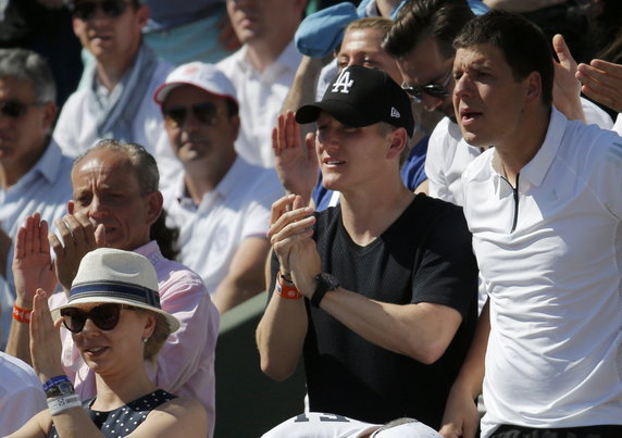 Bayern Munich's soccer player Schweinsteiger watches the women's semi-final match between Ivanovic of Serbia and Safarova of the Czech Republic during the French Open tennis tournament at the Roland Garros stadium in Paris