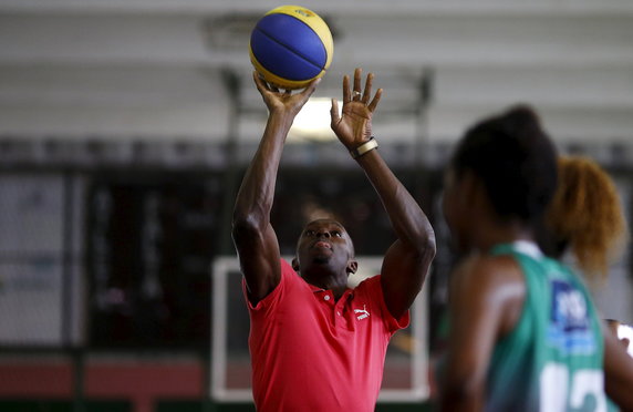 Jamaican Olympic gold medallist Bolt plays basketball with youths at Mangueira slum Olympic center, ahead of the "Mano a Mano" challenge, a 100-meter race which will be held on this Sunday, in Rio de Janeiro