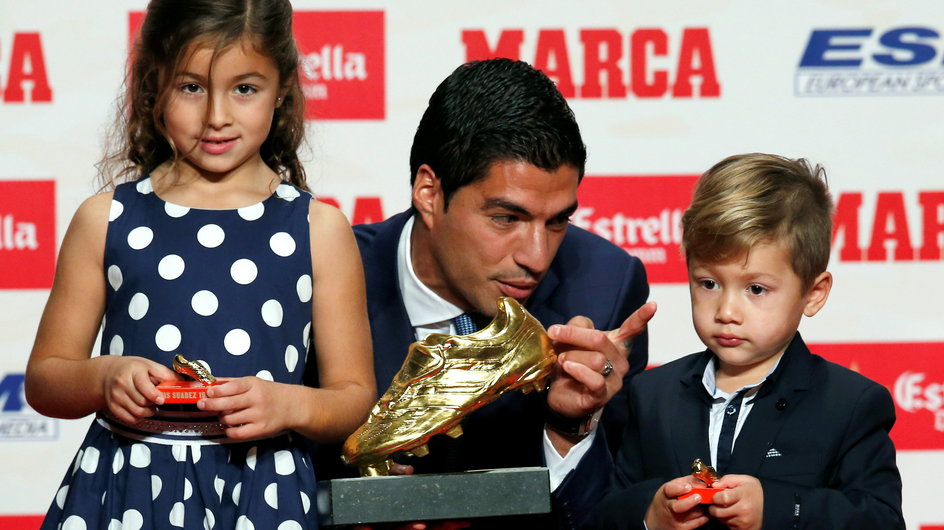 Barcelona's Suarez poses with European Golden Shoe trophy during a ceremony in Barcelona