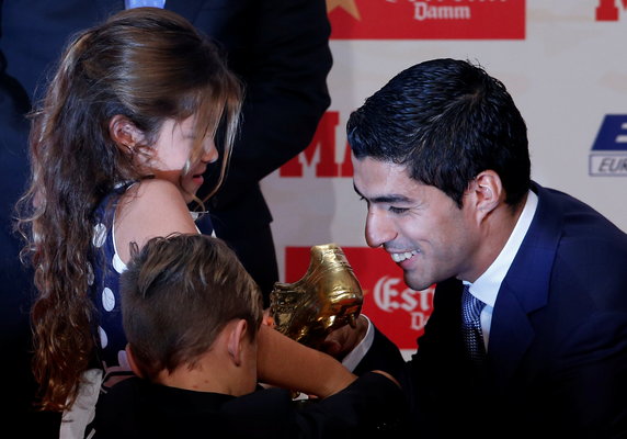 Barcelona's Suarez receives European Golden Shoe trophy during a ceremony in Barcelona
