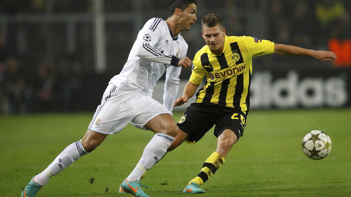 Cristiano Ronaldo (L) i Łukasz Piszczek (P)