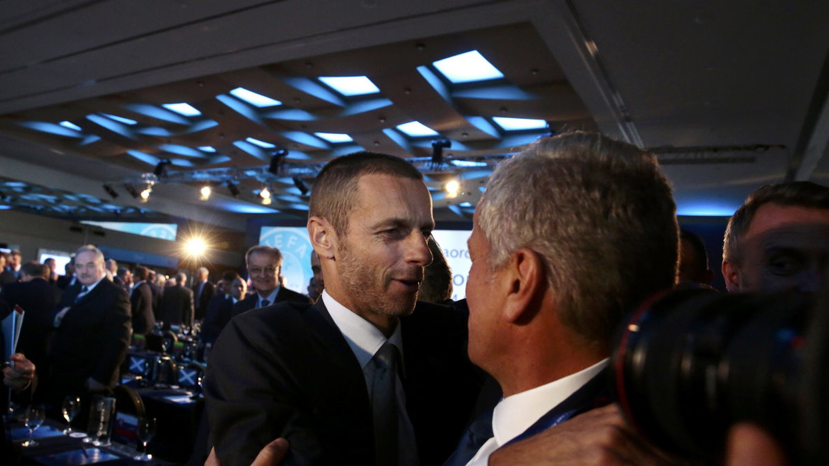 A man congratulates newly elected UEFA President Ceferin of Slovenia during the Extraordinary Congress in Athens