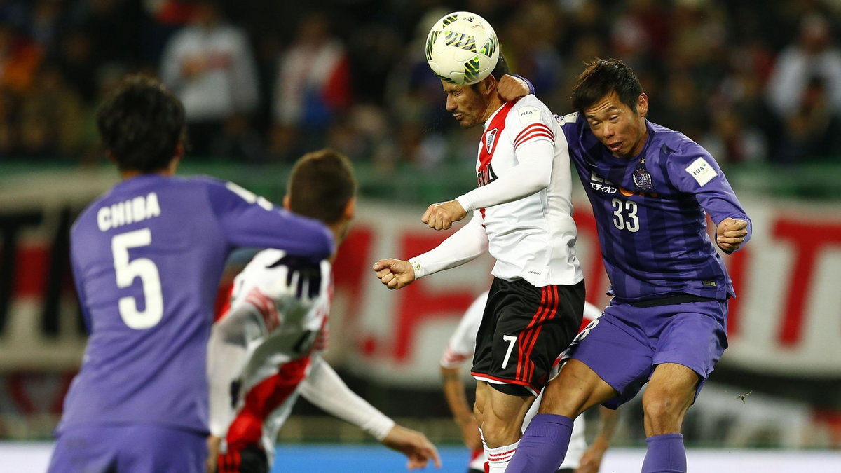 Mora of Argentine club River Plate and Shiotani of Japan's Sanfrecce Hiroshima fight for the ball during their Club World Cup semi-final soccer match in Osaka