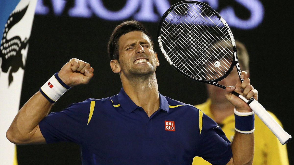 Serbia's Djokovic celebrates after winning his semi-final match against Switzerland's Federer at the Australian Open tennis tournament at Melbourne Park