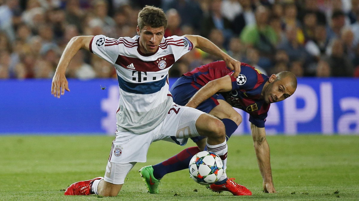 Thomas Mueller (L) i Javier Mascherano