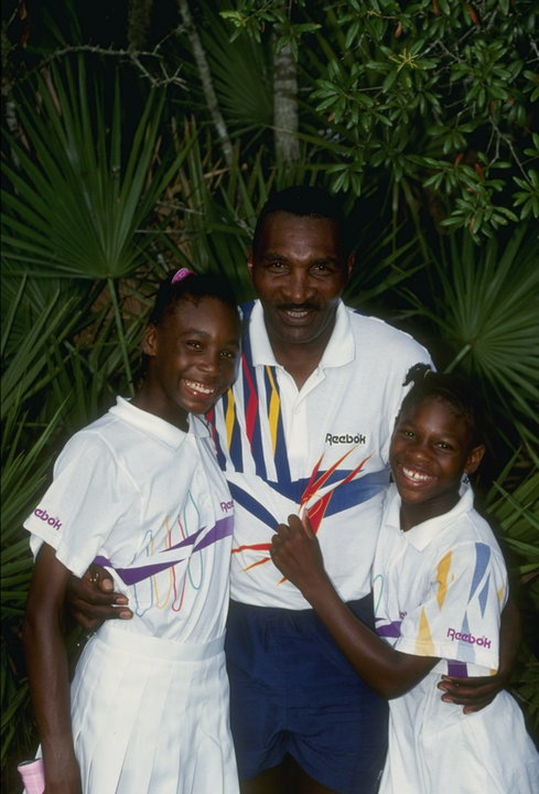 Serena Williams stands with her sister Venus Williams and father Richard Williams at a tennis camp in Florida. 1992