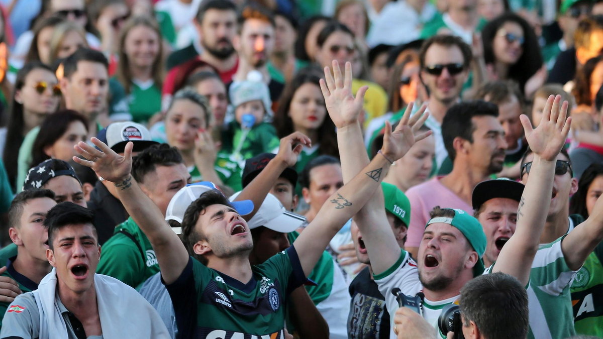 Fans of Chapecoense soccer team gather in the streets to pay tribute to their players in Chapeco