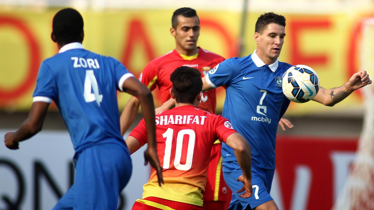 Iran's Foolad forward, Esmaeil Sharifat (C) vies for the ball with Saudi Arabia's al-Hilal players, Abdulla al-Dossary (L) neves Augusto Thiago (R) during the AFC champions league Group C football match at Ghadir stadium in Ahvaz on March 17, 2015. AFP PH