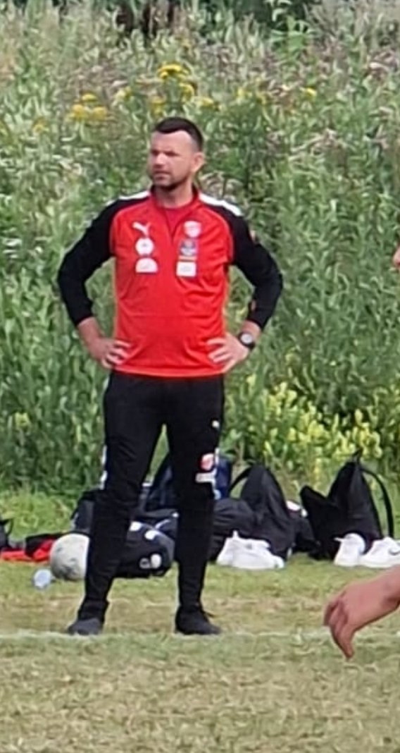 Łukasz Ciborowski w roli trenera juniorów SK Rival podczas turnieju Norway Cup