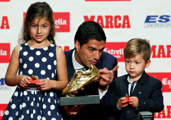 Barcelona's Suarez poses with European Golden Shoe trophy during a ceremony in Barcelona