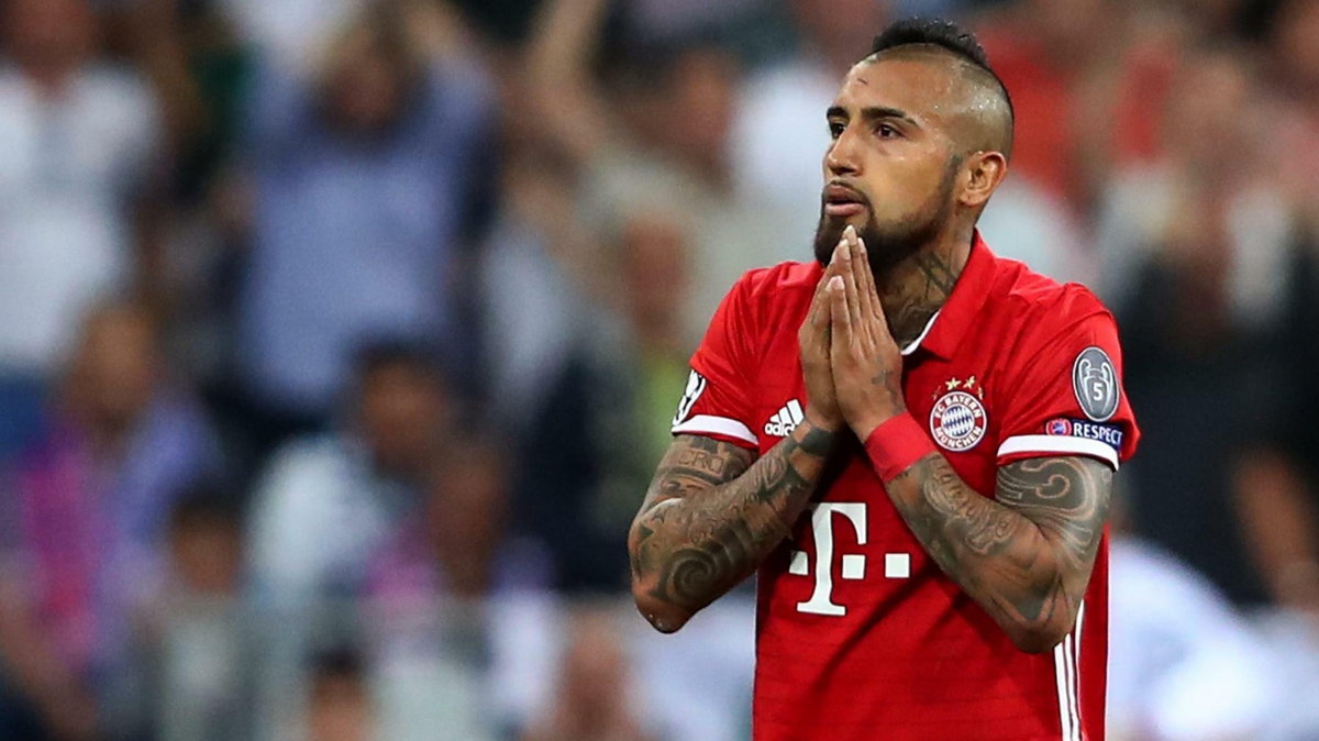 Bayern Munich's Arturo Vidal looks dejected after being sent off